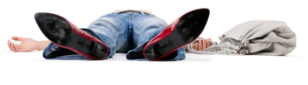 A woman laying on the ground, exhausted.