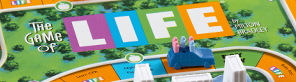 Pieces and the board of The Game of Life, a popular boardgame.