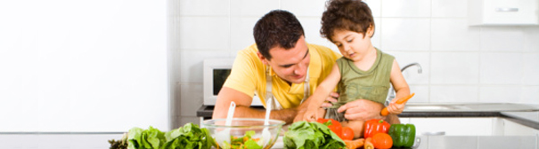 Father and son cooking together