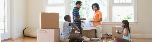 Family unpacking boxes