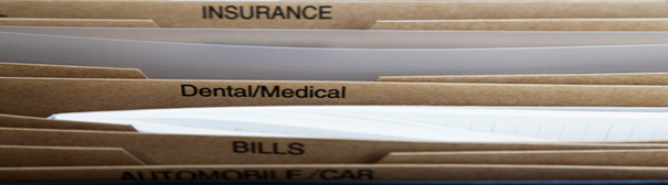 Photo: Folders of insurance, medical, and bills