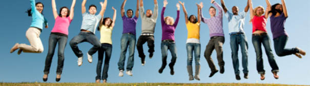 Group of young adults jumping