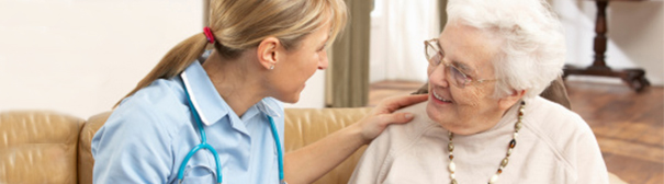 Photo of an elderly woman and a nurse