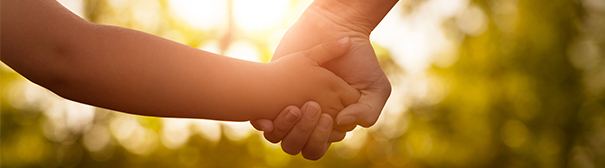 Parent and child holding hands