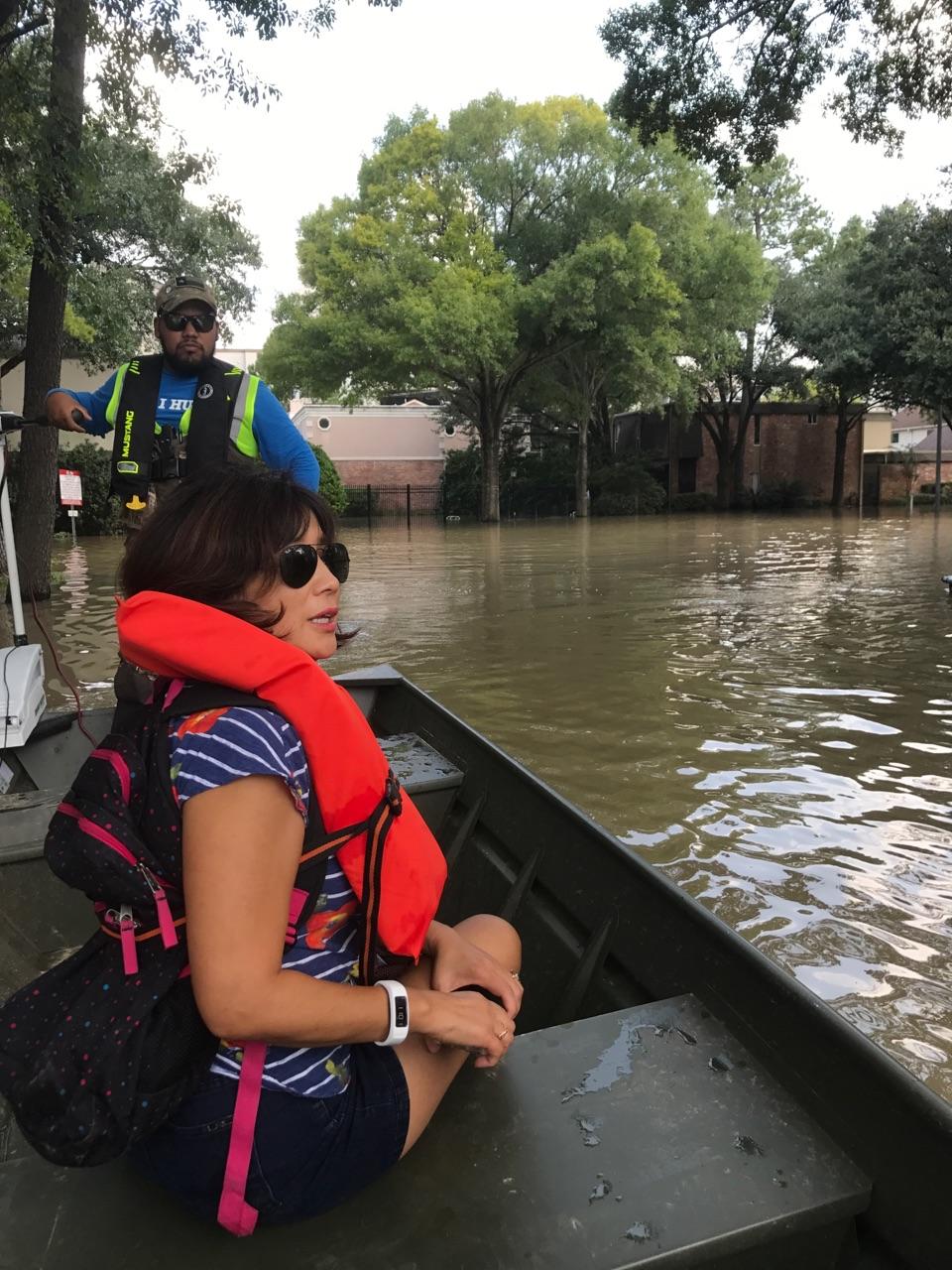 West Houston homeowner Mary Sit surveys flooding in her neighborhood caused by a release of dam water several days after Hurricane Harvey made landfall. Photo credit goes to Amy Sit Duvall