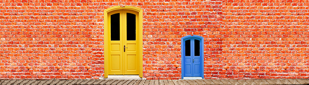 Brick wall with one small and one large door